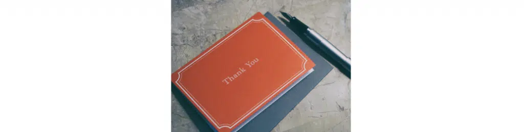 A thank you card and pen