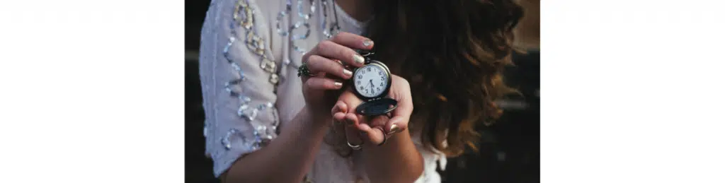 Woman holding a pocket watch