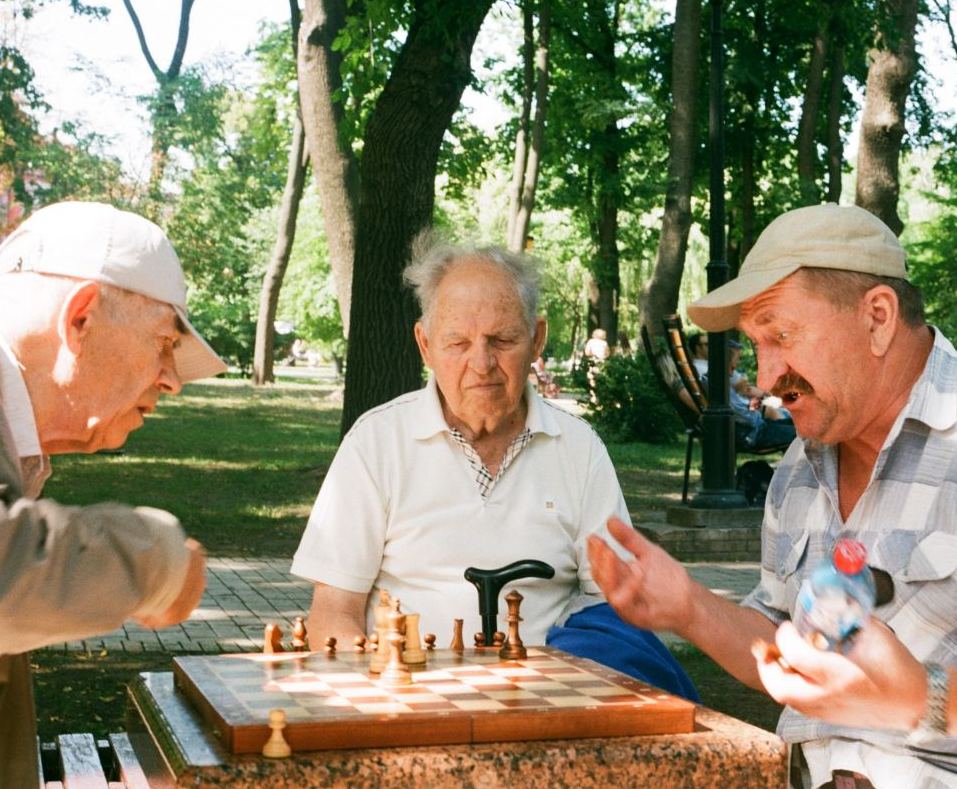 Three old men play chess