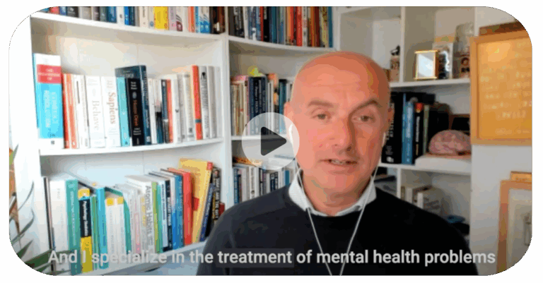 A man speaks in a video call, sitting in front of shelves filled with books; subtitles are visible, making it accessible for healthcare professionals joining the discussion.